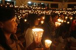Catholics hold lamps lit by candles during the Easter morning mass in Saint Theresia church in Cipanas, Bogor, West Java, Indonesia on April 4th, 2010. Christians in West Java have been barred from some churches in recent years as local Muslim groups campaign for their closure. [Reuters]