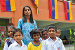 Ladang Bukit Jalil school headmistress Sitha Thangavaloo, pictured here with students that attend the Tamil school in Malaysia, which is thriving despite many challenges. [Photo by Grace Chen]