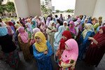 Malaysian government workers gather outside their office building in Putrajaya, outside Kuala Lumpur, following a 2007 earthquake that pounded Indonesia's Sumatra coast. Experts are warning Malaysians to be prepared for natural disasters potentially hitting closer to home. [Bazuki Muhammad/Reuters]