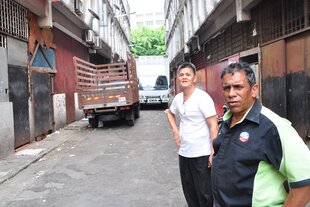 Samuel Fong (left) and Faizal Abdullah (right) stand in the 
