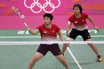 Indonesia's Greysia Poli (rear right) and Meiliana Jauhari play against South Korean opponents during the 2012 Olympic Games on July 31st. The World Badminton Federation charged the pair and six other athletes with misconduct on August 1st for attempting to throw matches to secure a more favourable spot later in the tournament. [Bazuki Muhammad/Reuters]