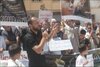 Rachid Lemlihi speaks at a July 2013 rally in Tetouan, Morocco, one month before he left for Syria. What he expected was far different from what he experienced: unwelcome foreigner fighters fighting one another, not Syrian government forces. [Mohamed Saadouni/Khabar]