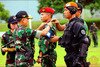  General Moeldoko (left), commander of the Indonesian armed forces (TNI), affixes a patch on a soldier's uniform during the December 1st opening ceremony of Tri Matra IX, a joint exercise among TNI's different branches at Halim Perdanakusuma Airport in Banten Province. [Courtesy of TNI] 