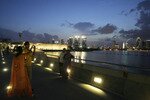 Tourists from South Asia take photos from the dam that runs across the Singapore River's mouth at Marina Bay. International tourist arrivals in Asia have skyrocketed in recent years, with South and Southeast Asia leading the way. [Reuters]