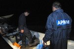 During a night time patrol on February 2nd, 2012, Malaysian Maritime Enforcement Agency (MMEA) agents board a boat thought to be carrying smuggled goods. [Grace Chen/Khabar Southeast Asia]
