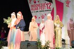 Models display a pastel rainbow of hijab ensemble styles at the Indonesia Hijab Fest 2012 in Bandung, West Java. Designers participating in the June 12th-15th event showed how Muslim women can express their religious beliefs while looking fashionable. [Cempaka Kaulika/Khabar]