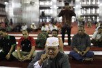 A man recites the Qur'an at the Istiqlal Mosque in Jakarta on July 24th. With some mosques appearing to compete with each other, the volume of loudspeakers is generating public debate. [Beawiharta/Reuters].
