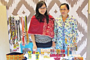 Brigita Elita, 23 (left), and her mother display handmade accessories that use traditional beadwork techniques of Kalimantan. Brigita aims to preserve a precious family tradition and maintain a high quality product. 
