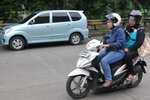 Motorcycles are a relatively affordable and common means of transportation in Indonesia. But women in Lhokseumawe, Aceh may face restrictions under a proposed new rule, forcing them to ride side-saddle – a practice which some say is unsafe. [Clara Prima/Khabar].