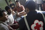 Medical personnel at an immigration centre in Lhokseumawe, Aceh attend to Rohingya Muslims on March 1st. The men were part of a group of 184 people rescued by Indonesian fishermen in waters off Sumatra after fleeing their homeland. Violence against Muslims in Burma is contrary to Buddhist values, an Indonesian Buddhist leader has said. [Sutanta Aditya/AFP]
