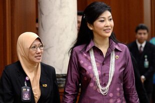 Thailand's Prime Minister Yingluck Shinawatra (front right) attends an ASEAN summit in Brunei in April. Her recent official visits to Sri Lanka and Maldives show Thailand's aspirations to widen its economic and diplomatic role in the region, analysts say. [Philippe Lopez/AFP]