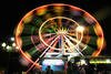 A giant ferris wheel offered amusement at Monas Fair in Jakarta, held July 10th-24th, to celebrate Ramadan. Festivalgoers enjoyed Betawi cuisine, rides, and the chance to browse hundreds of booths displaying the wares of small-scale businesses. [Zahara Tiba/Khabar]