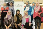 The Laiqa Magazine editorial team poses in front of their booth at the HijUp Festival in Jakarta on April 13th. The magazine aims to share positive stories about inspirational women, education, and business, pairing Islamic values with fashion advice. [Cempaka Kaulika/Khabar]