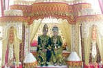 A bride and groom sit together amid gorgeous decorations in Siglie, Aceh on August 23rd. Wedding traditions from all over the province are on exhibit during Aceh Culture Week (PKA) in Banda Aceh from September 20th-29th. [Nurdin Hasan/Khabar]