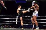 Antoine Pinto of France delivers a kick to American Dorian Price during the 70kg bout at "Thai Fight Extreme" held in Pattani on Sunday (September 29th). The nine-bout event drew 40,000 fans – twice as many as organisers anticipated. [Somchai Huasaikul/Khabar]