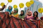 Employees of Indosat, a major telephone company in Indonesia, gather during a ceremony to mark National Batik Day in Jakarta on October 2nd, 2012. "It is always good to see that Indonesian Muslims care about heritage," a religious leader said. [Romeo Gacad/AFP]