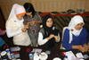 Restu Maharani (second from left) and neighbours in Bandung, West Java practice making jewellery. Young people are turning to handicrafts like hand-made jewellery as a small business opportunity. [Andhika Bhakti/Khabar]