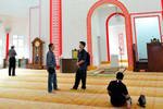 Worshippers gather inside the main prayer hall of Muhammadiah Mosque in Ipoh, Perak. The new mosque is the first in Malaysia to feature Chinese architecture. [Grace Chen/Khabar]