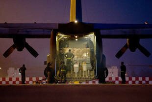 Malaysian air force personnel at Suban Air Force base load relief supplies into a Royal Malaysian Air Force C130 for victims of Super Typhoon Haiyan in the Philippines on Wednesday (November 13th). Malaysia also pledge $1m in aid in addition to providing and transporting supplies. [Mohd Rasfan/AFP]