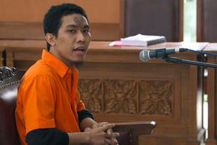 Separiano, a suspect in a plot to bomb the Burmese Embassy in Jakarta, speaks during the first day of his trial in Jakarta on November 6th. He told the court he used money donated during an Islamic study group (Majelis Taklim) to buy explosives. [Bay Ismoyo/AFP] 