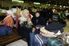 Migrant workers wait at Soekarno-Hatta airport in Jakarta in December 2007. The Indonesian government has begun repatriating thousands on undocumented Indonesian migrant workers expelled from Saudi Arabia under its stiff new labour law. [Adek Berry/AFP]