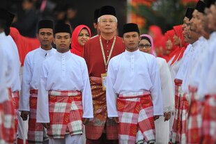 Prime Minister Najib Razak (centre) participates in the December 5th opening of the United Malays National Organisation (UMNO) annual general assembly in Kuala Lumpur. [Mohd Rasfan/AFP]