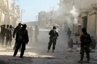 Jabhat al-Nusra (JAN) members fight government forces on the outskirts of Aleppo. JAN members have also battled other al-Qaeda-linked groups in Syria. [Baraa al-Halabi/AFP]