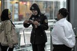A police officer inspects the passport of a passenger at Kuala Lumpur International Airport on Sunday (March 9th). Only "a handful of countries" ensure passengers with stolen passports do not board international flights, according to Interpol. [Mohd Rasfan/AFP]