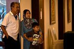 Relatives of a passenger on missing Malaysia Airlines flight MH370 wait in the lobby Wednesday (March 12th) at the Everly hotel in Putrajaya, on the outskirts of Kuala Lumpur. [Manan Vatsyayana/AFP]