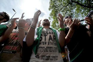 Syrians living in Malaysia pray during a 'Global Day of Solidarity with the Syrian Revolution' in Kuala Lumpur on May 31st, 2013. A new terrorist group in Malaysia has sent members posing as humanitarian workers to conduct jihad in Syria, officials say. [Mohd Rasfan/AFP]