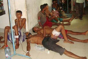 Men rescued from a human smuggling boat in the Bay of Bengal are treated in a hospital in Teknaf, Bangladesh on Thursday (June 12th). [AFP]