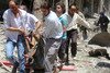  Syrians carry a body after a bombing in Aleppo on July 10th. Malaysian leaders warn Muslim youth against falling for jihad recruiters spreading false messages. [Aleppo Media Centre/Khaled Khatib/AFP] 