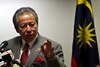  Malaysian Foreign Affairs Minister Anifah Aman addresses reporters in Putrajaya on July 1st. Anifah recently said regarding domestic jihadists: "We neither condone nor support Malaysian nationals who commit terrorism or participate in conflicts abroad". [Manan Vatsyayana/AFP] 